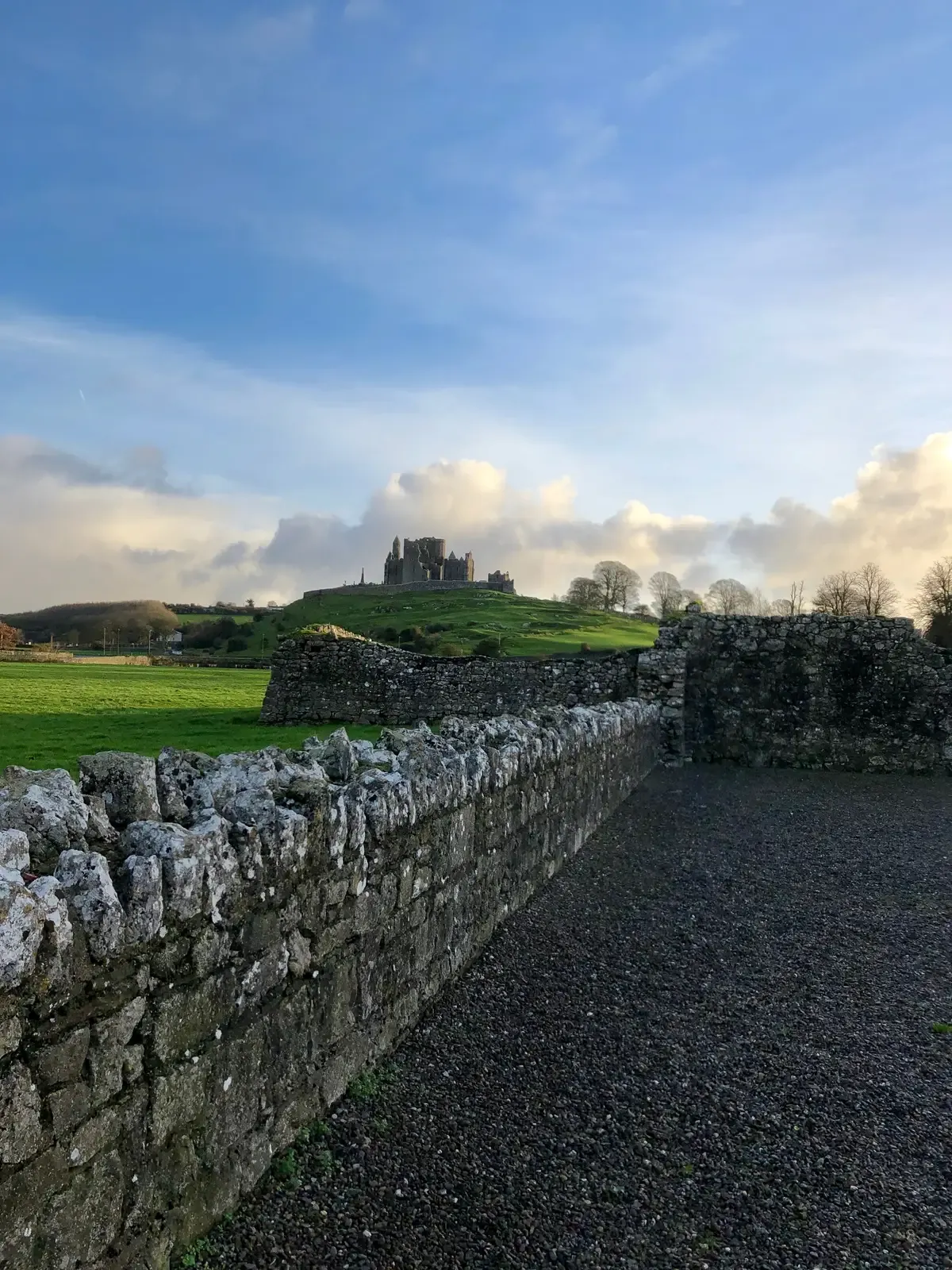 The Rock of Cashel seen from a distance on an Ireland itinerary